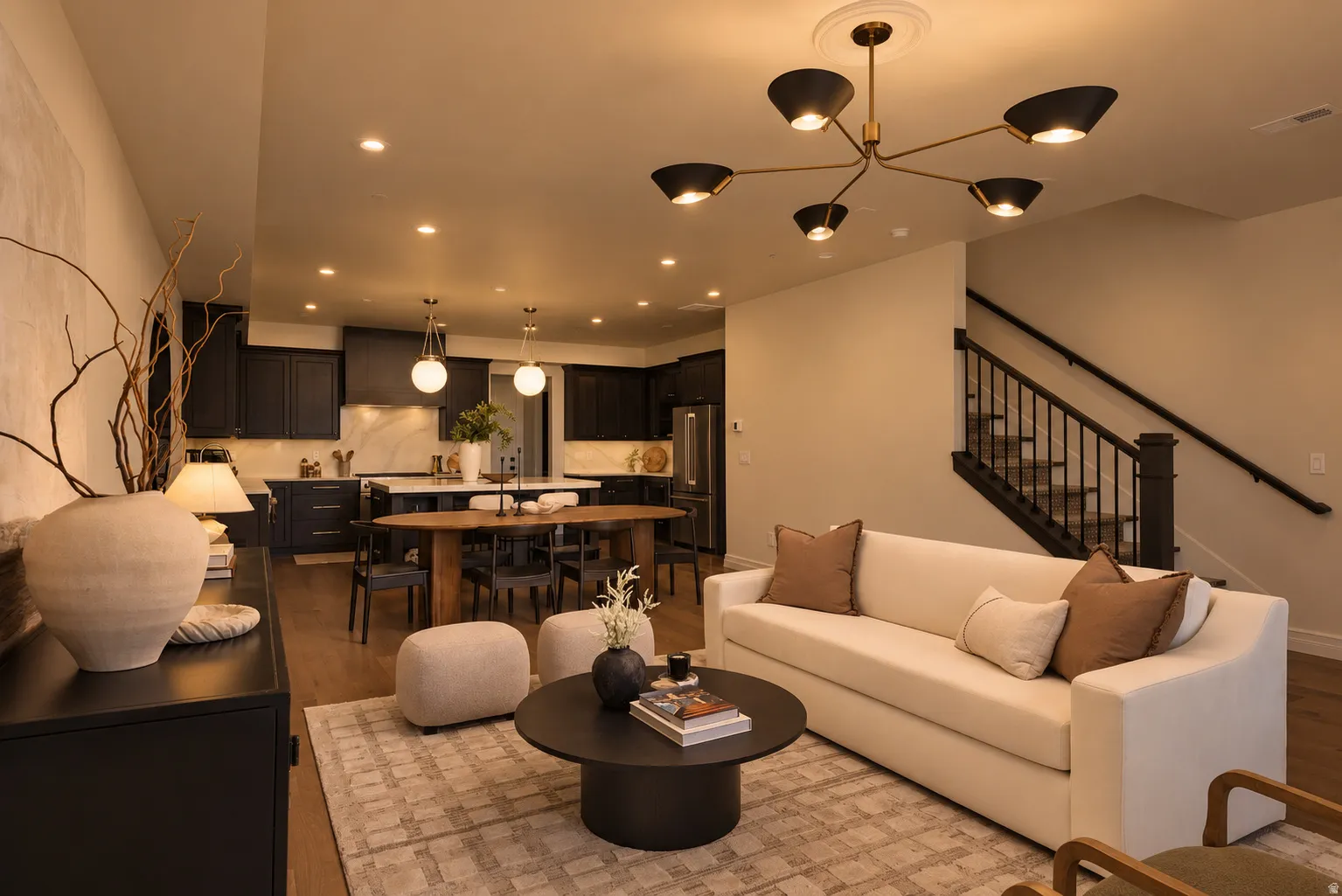 Open-concept living area featuring wood-finish flooring and recessed lighting