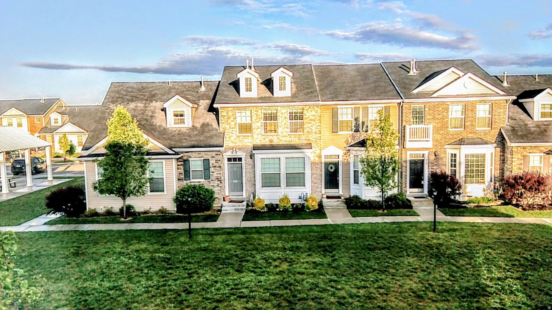 Stone and siding exterior with gabled roof lines and dormer windows