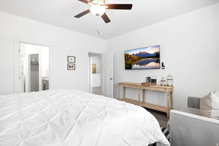 Recessed lighting, wood-finish flooring, ceiling fan, and white painted walls