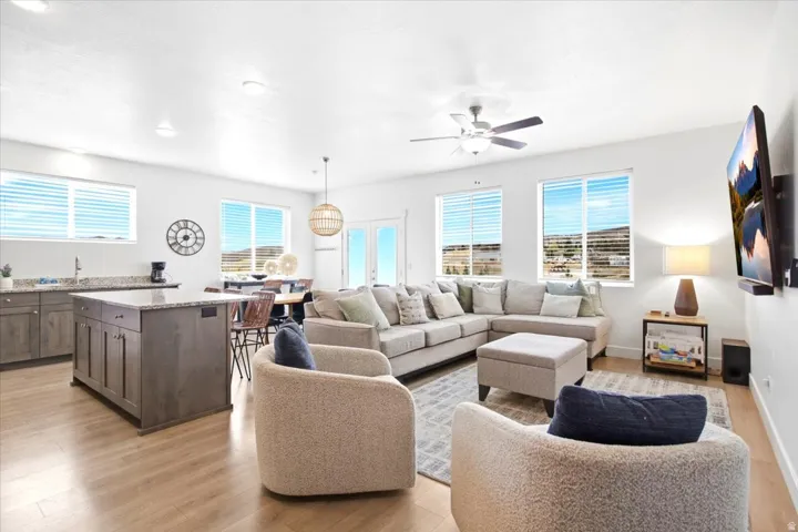 Open-concept living area featuring wood-finish flooring