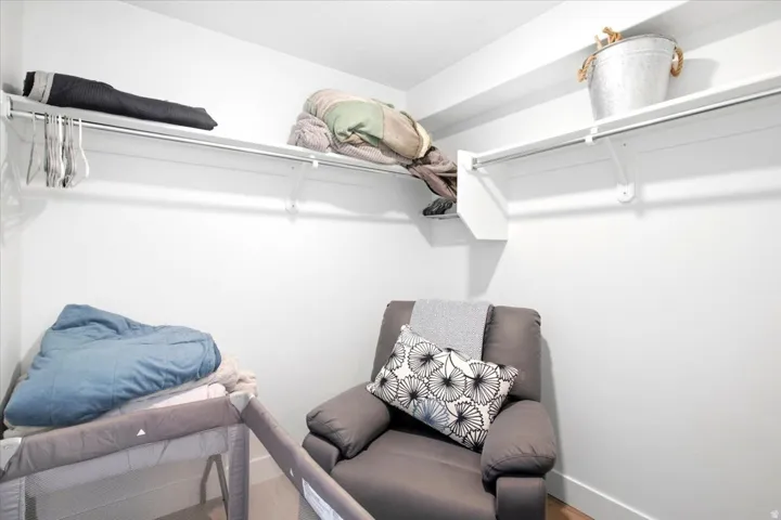 White walls with built-in shelving and hanging rods