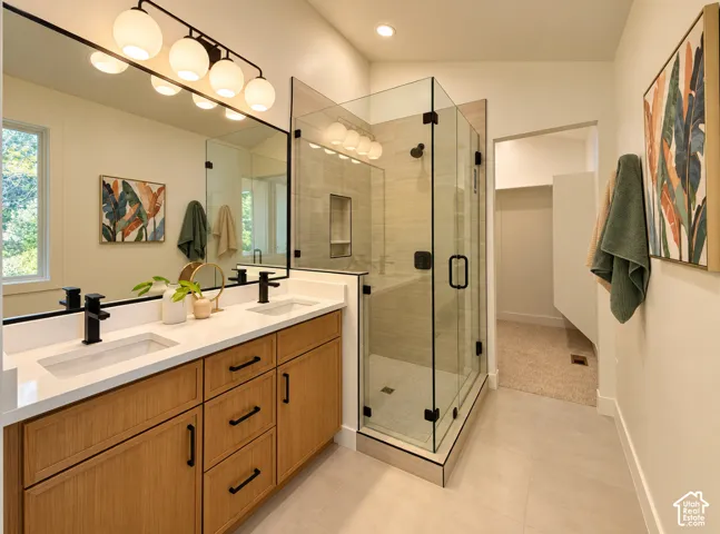Dual vanity with wood-finish cabinetry and rectangular undermount sinks