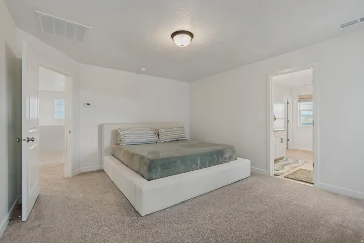 Neutral wall tones and gray-toned carpeting