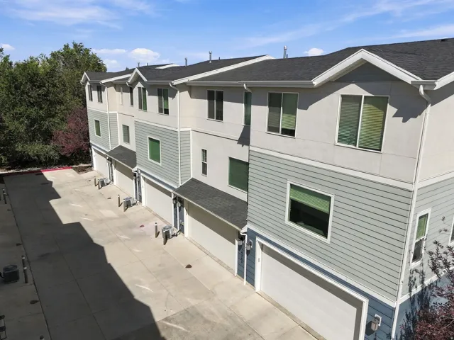 Modern multi-story exterior with a combination of stucco and horizontal siding