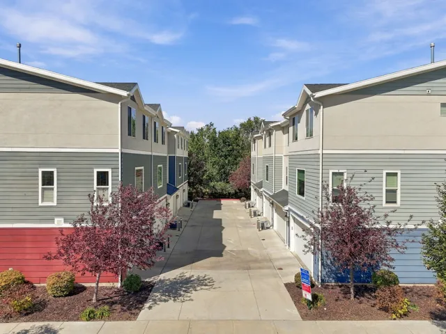 Contemporary townhome exteriors featuring multi-toned siding and stucco