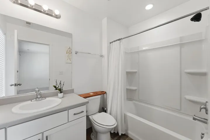 Vanity with integrated sink, chrome faucet, and cabinet storage