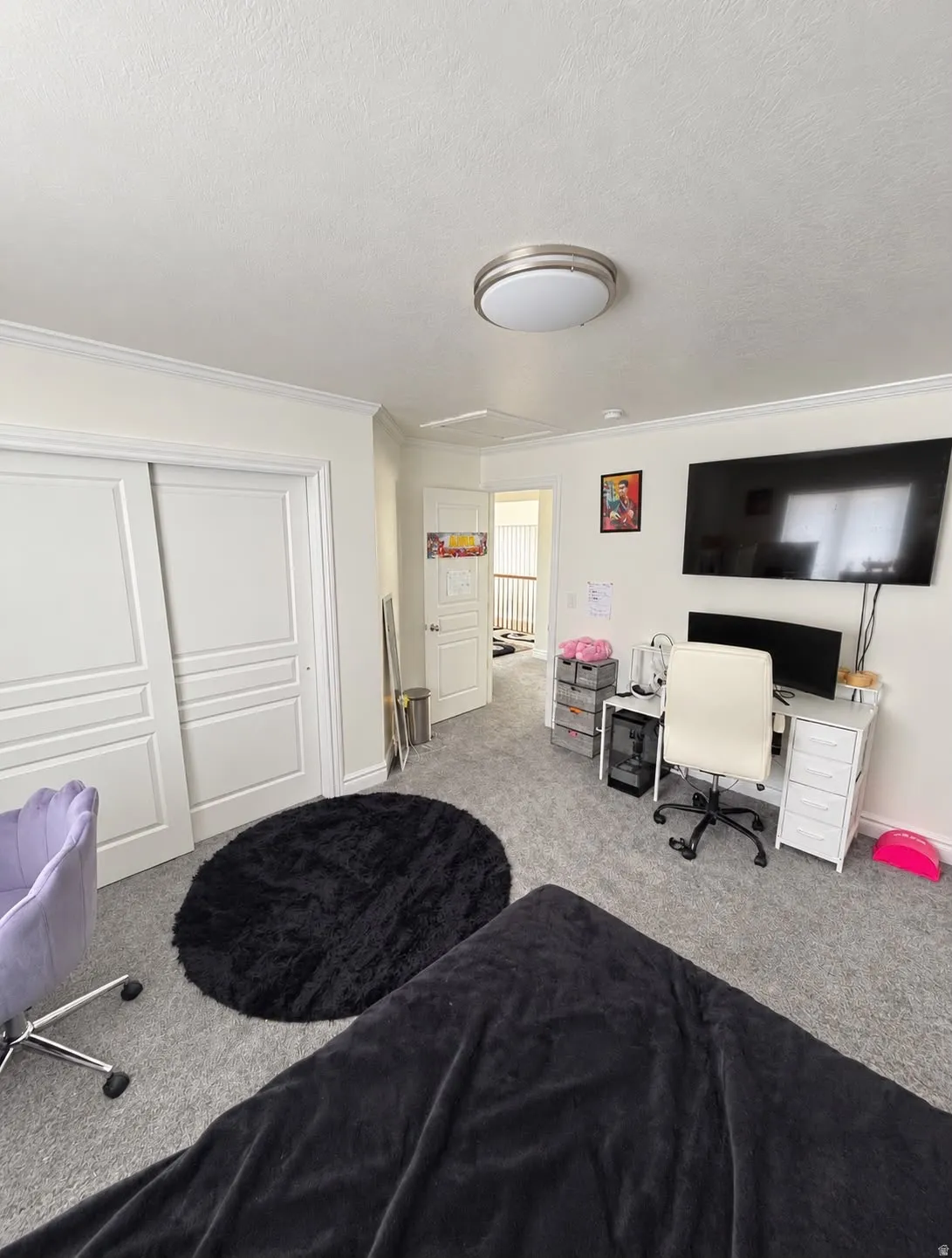 Wall-to-wall carpeting with crown molding, double sliding closet doors, and recessed lighting