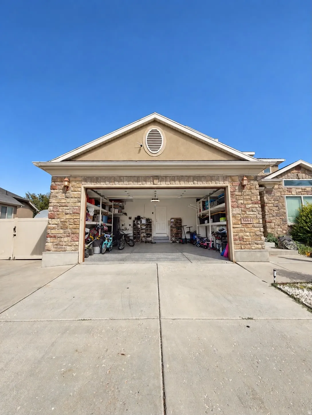 Stone veneer facade with stucco accents