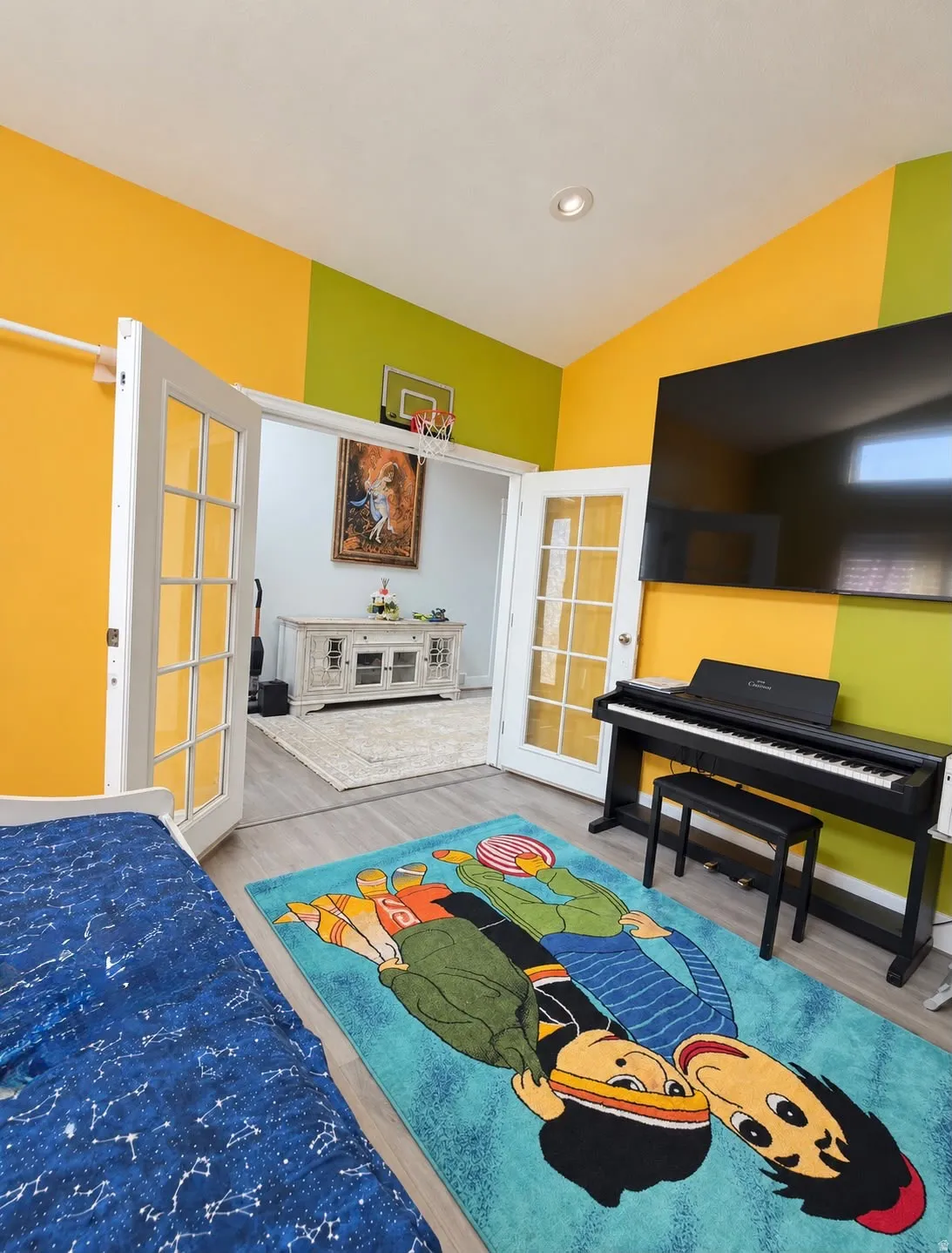 Recessed ceiling lighting, wood-finish flooring, and French doors