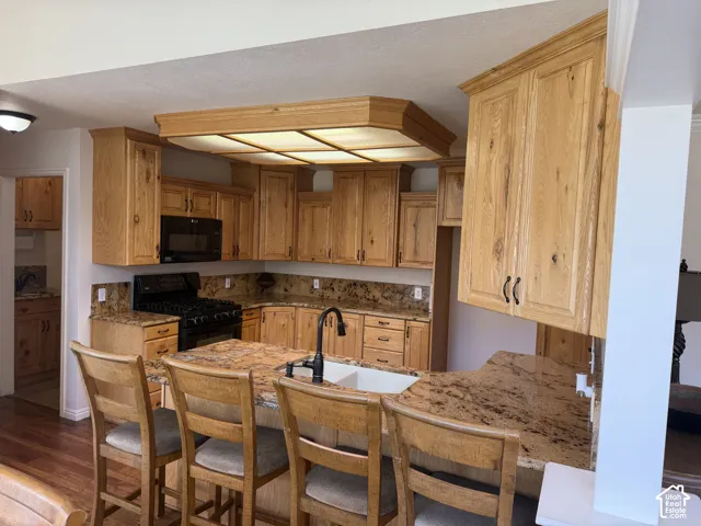 Wood-finish cabinetry paired with granite countertops