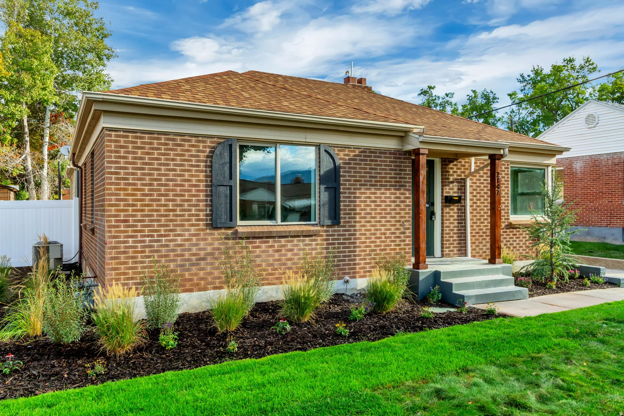 Brick exterior with contrasting dark shutters