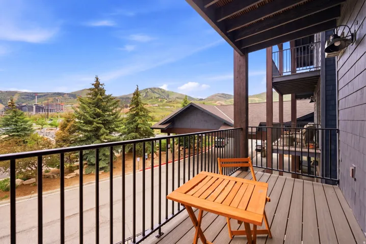 Balcony with composite decking and black metal railing