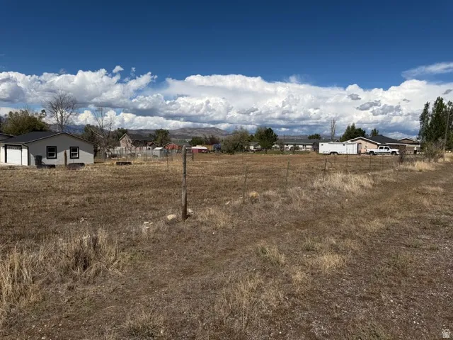 Expansive undeveloped lot with distant mountain scenery