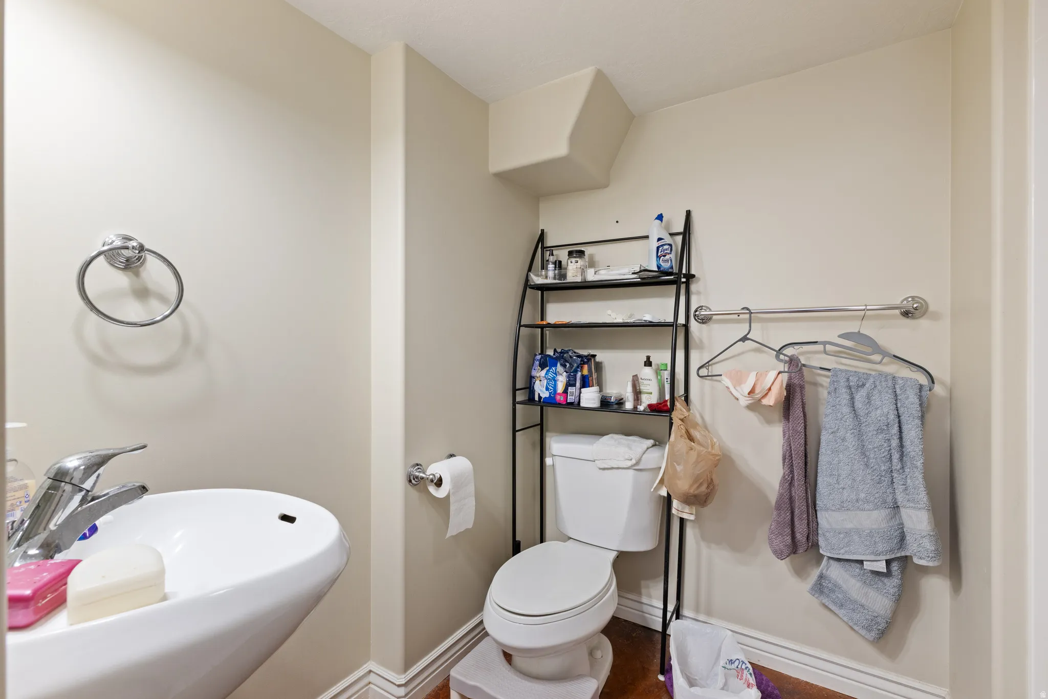 Wall-mounted porcelain sink with a chrome faucet