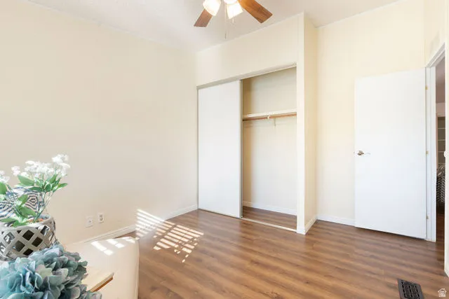 Wood-finish flooring, ceiling fan, and sliding closet doors