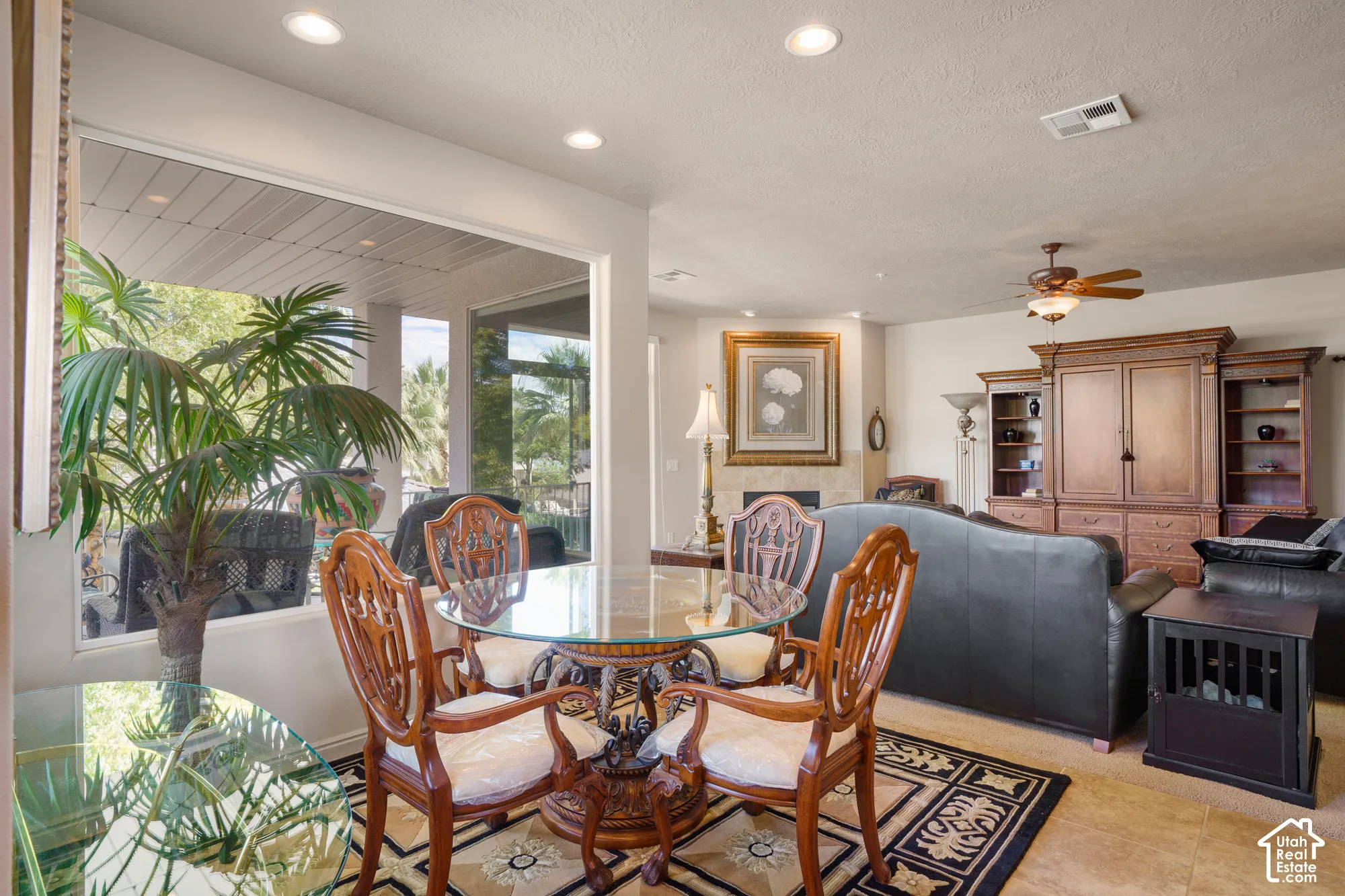 Recessed lighting, ceiling fan, and large windows