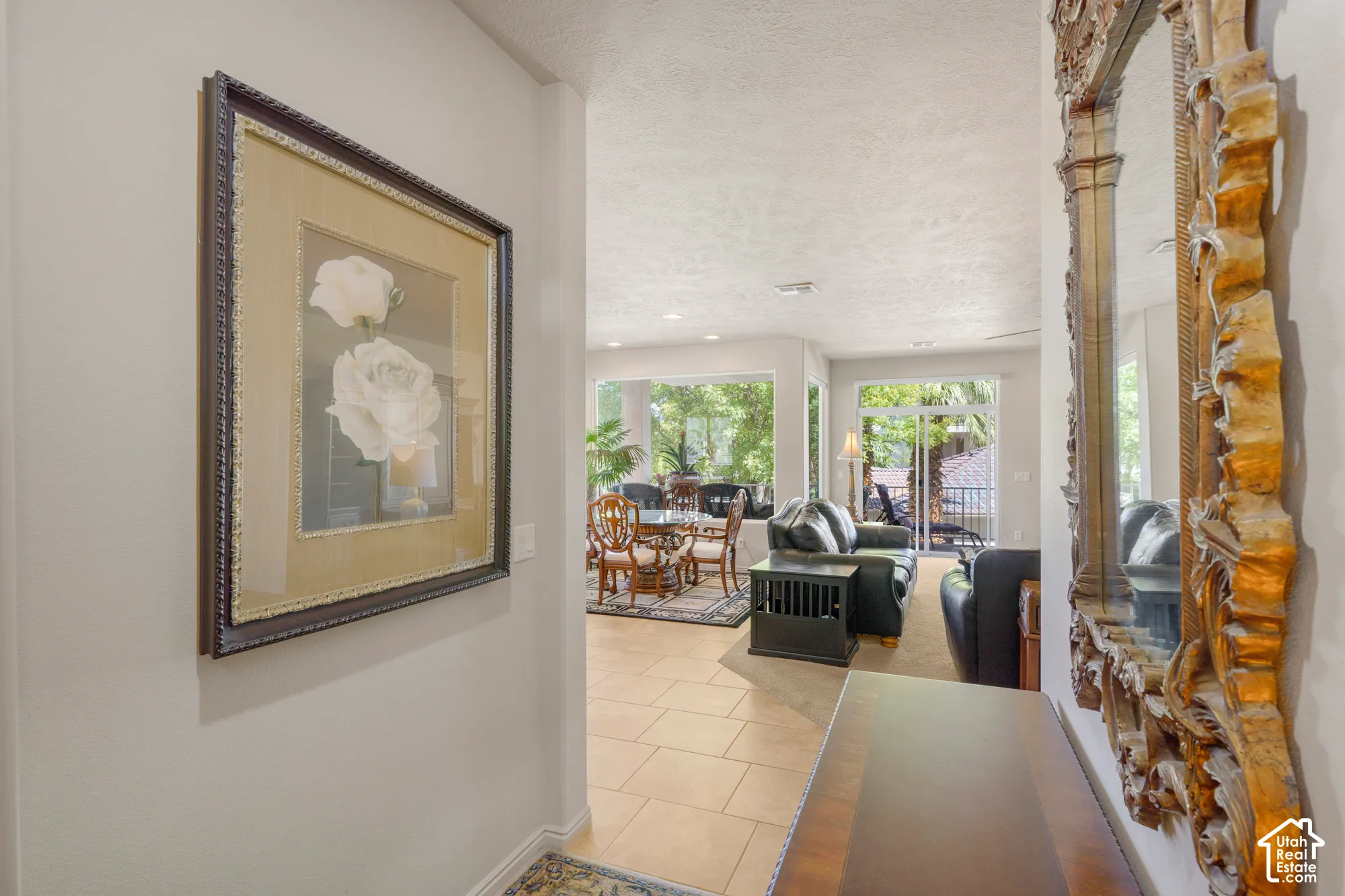 Recessed lighting, tile flooring, glass doors, and expansive windows