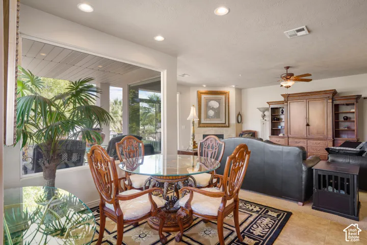 Recessed lighting, ceiling fan, and large windows