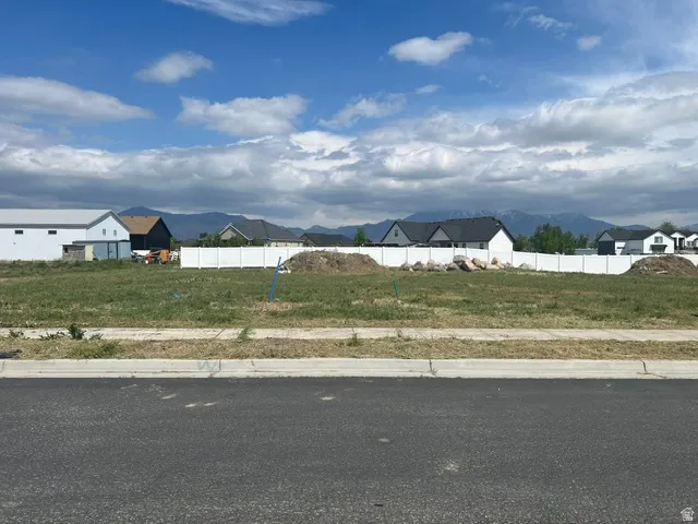 Level lot featuring a white perimeter fence