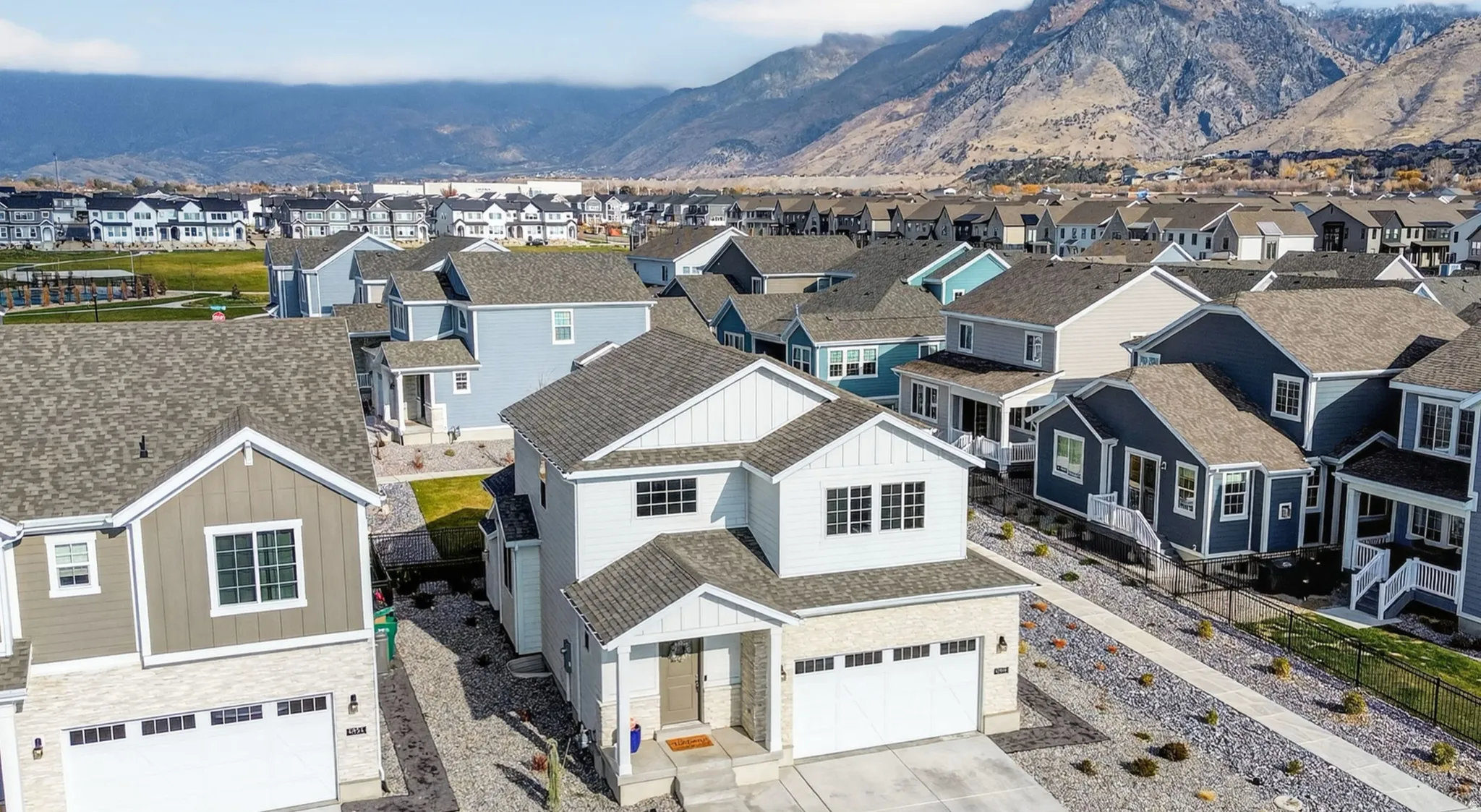 Residential neighborhood featuring diverse architectural styles and mountain scenery
