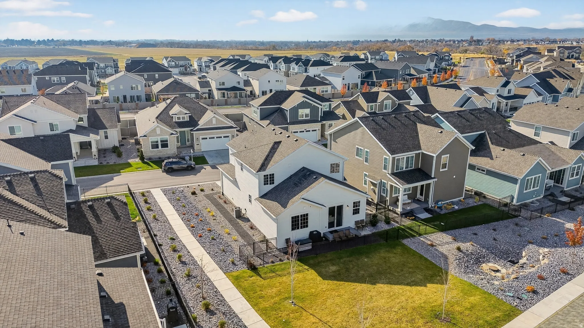 Expansive residential development featuring varied architectural styles and mountain scenery
