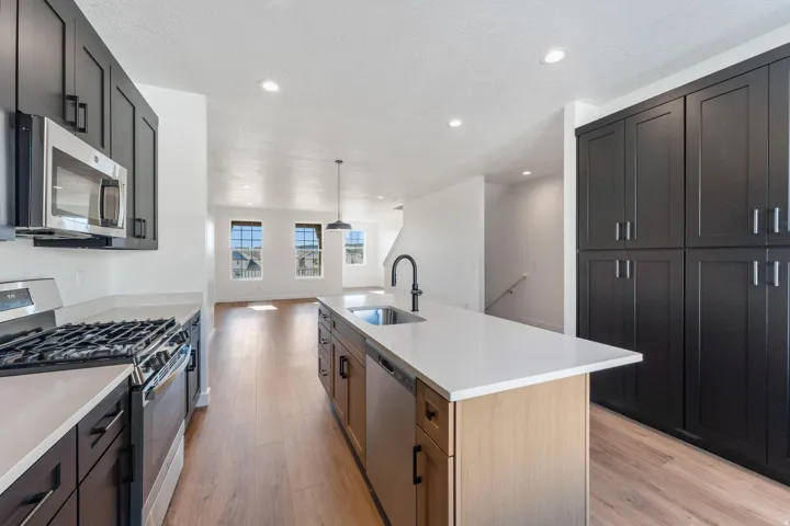 Well-appointed kitchen featuring a stainless steel gas range, microwave, and dishwasher