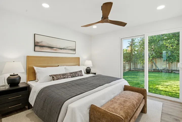 Wood-finish flooring, recessed lighting, and a modern ceiling fan