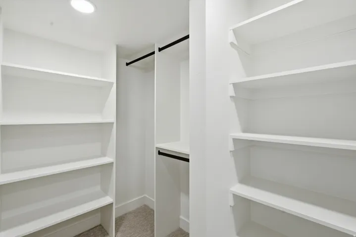Built-in closet shelving with integrated hanging rods