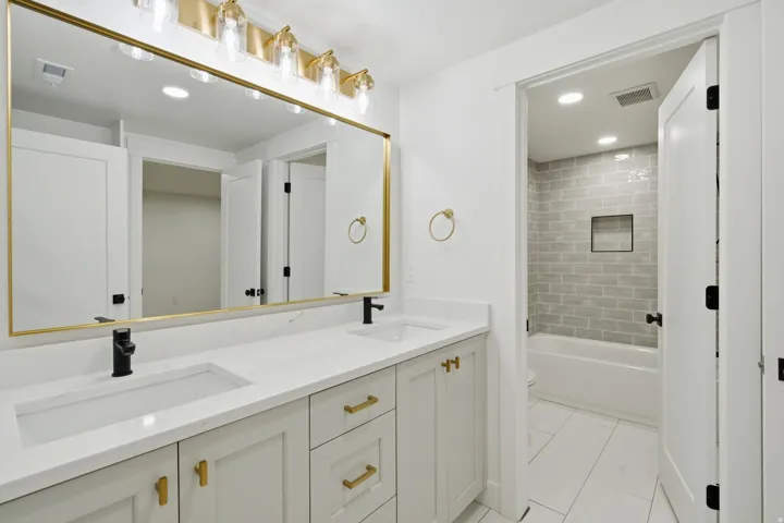 Double vanity with integrated sinks and quartz countertops