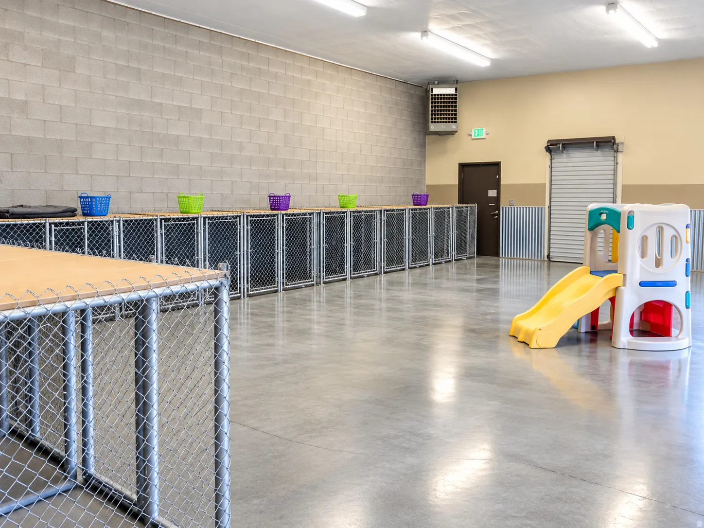 Spacious interior with concrete flooring and block wall construction