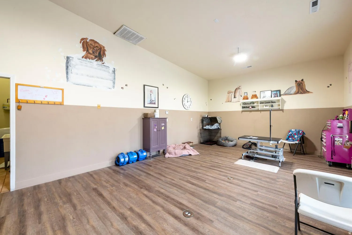 Wood-finish flooring throughout, with neutral two-tone painted walls