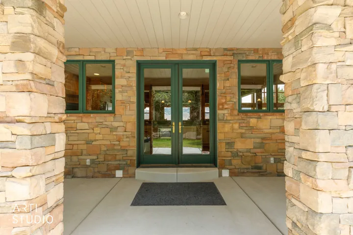 Backyard porch.  French door entry to the kitchen.