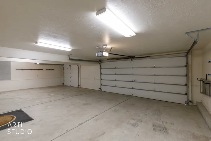 Spacious 3-car painted garage.