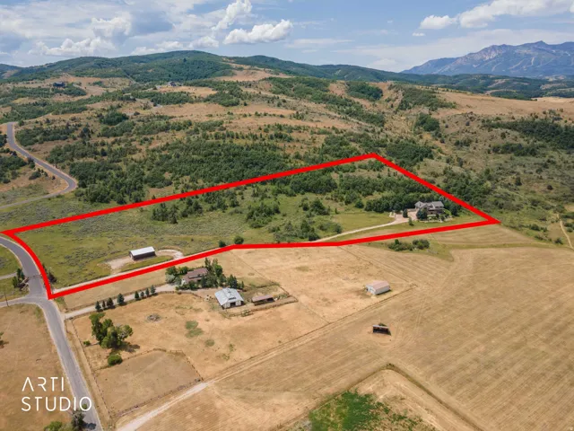 View from the north. This is the property for sale. 13.44 acres, house, cabin. Tax Id 21-035-0101.