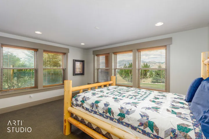 View from basement level bedroom. Two-toned paint and cased wood-clad windows.