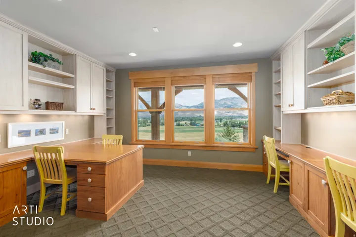 Built-in desks, integrated cabinetry, open shelving, and recessed lighting under cabinets. 4 work/play stations