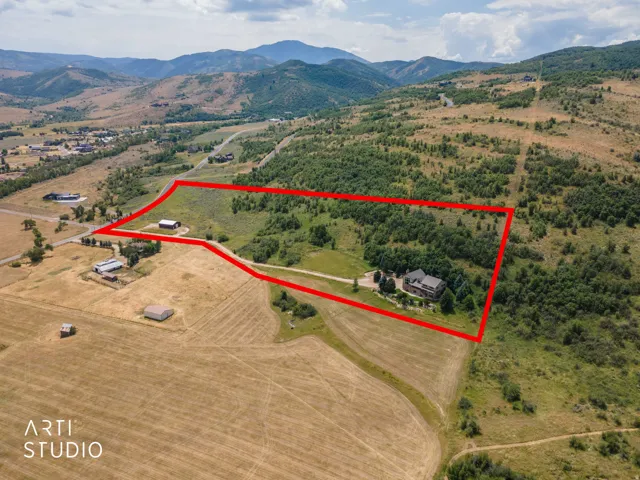 View looking south of property for sale. 13.44 acres, house, and barn.