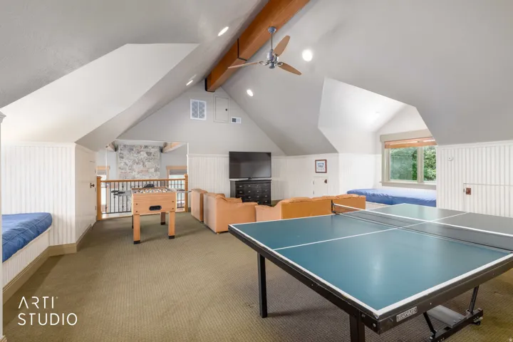 Recreation room.  Vaulted ceilings, exposed wood beam, balcony view down, into the great room, four fun kid's playrooms on each side of built-in window seats.