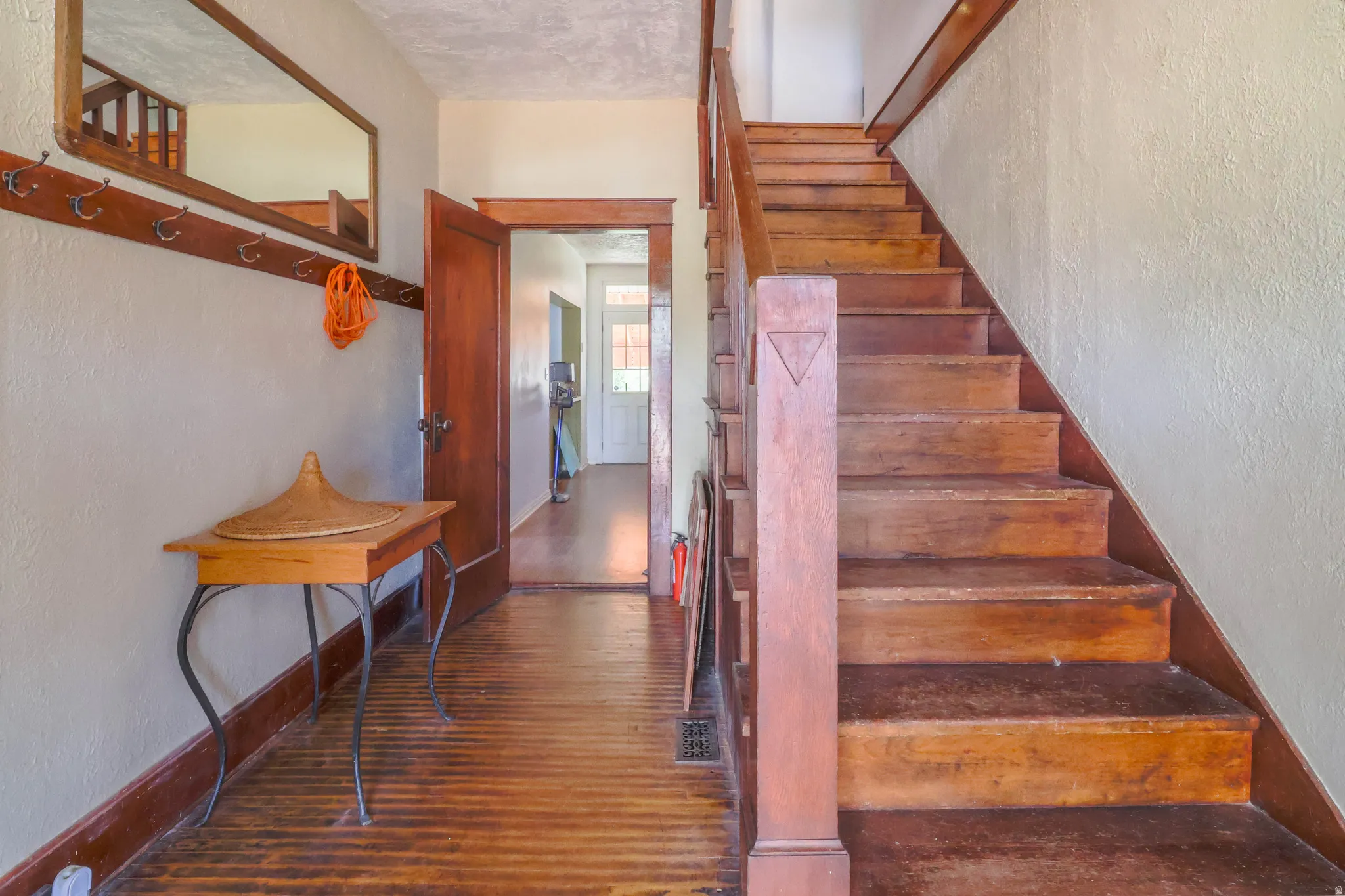 Hardwood flooring and staircase with wood newel post
