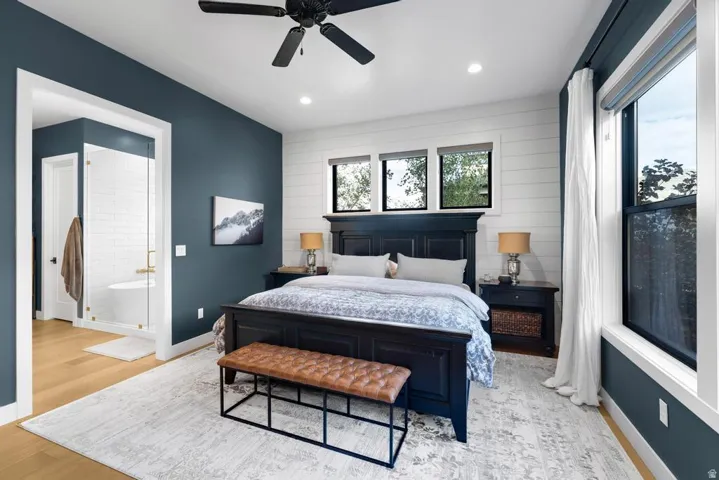 Recessed lighting, wood-finish flooring, and a ceiling fan