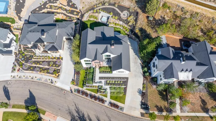 Contemporary residence with a dark-pitched roof and light-toned exterior