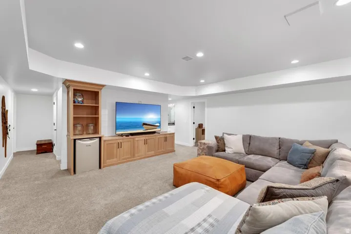 Built-in entertainment center with integrated shelving and beverage refrigerator