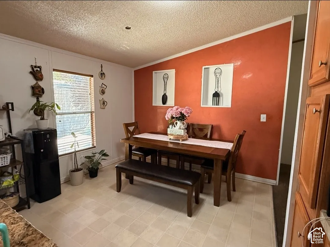 Recessed wall niches, light-toned flooring, white baseboards, and a window with blinds