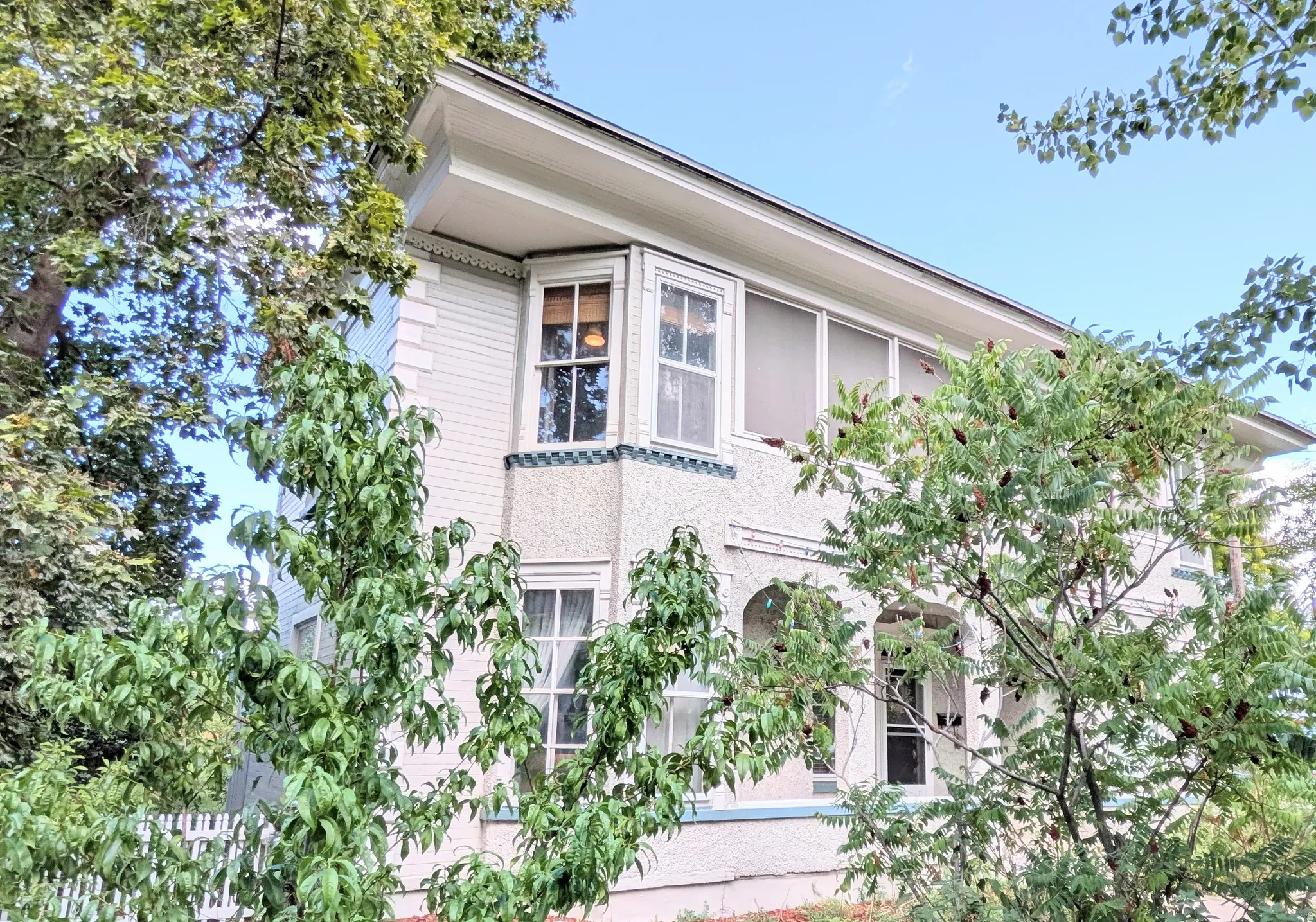 White clapboard siding with decorative trim