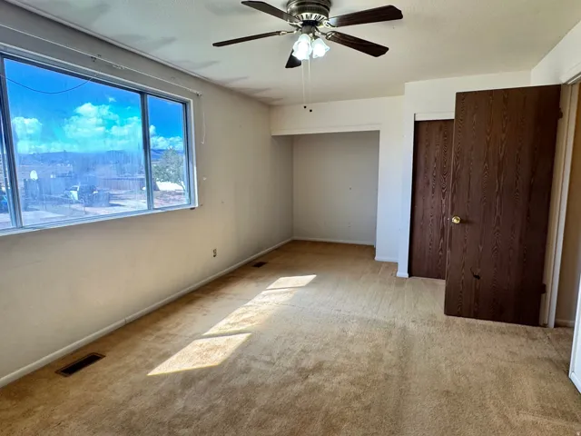 Unit 1, Bedroom 3:  Large main Bedroom with oversized window. (This room is currently connected via doorway to the large main bedroom in  2nd unit; creating 1 double sized Main Bedroom.  This doorway could be closed off for a large Main Bedroom in each un