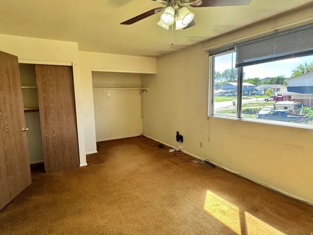 Unit 2, Bedroom 1: Large main Bedroom with oversized window. (This room is currently connected via doorway to the large main bedroom in  2nd unit; creating 1 double sized Main Bedroom.  This doorway could be closed off for a large Main Bedroom in each uni
