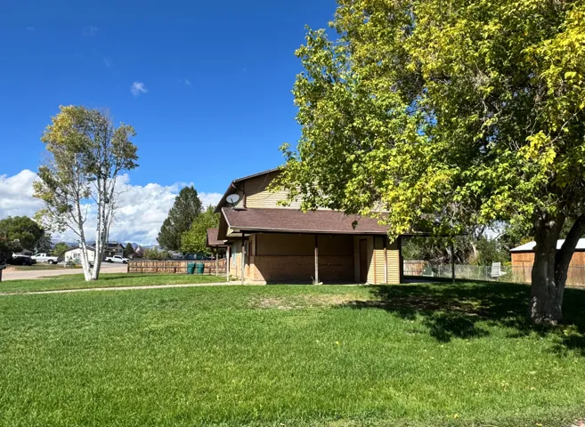 Property is on a corner lot.  Each unit has it's own carport.  Storage shed is included