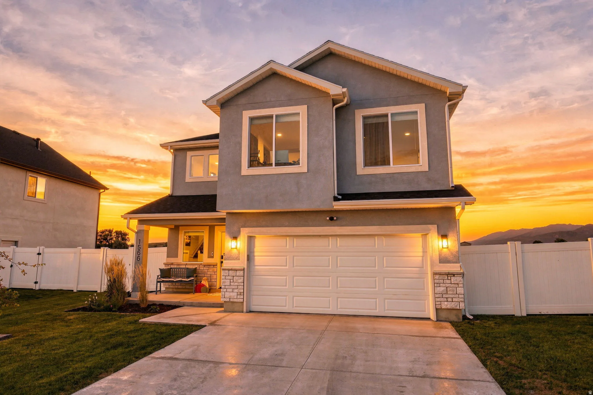 Contemporary stucco exterior with stone accents