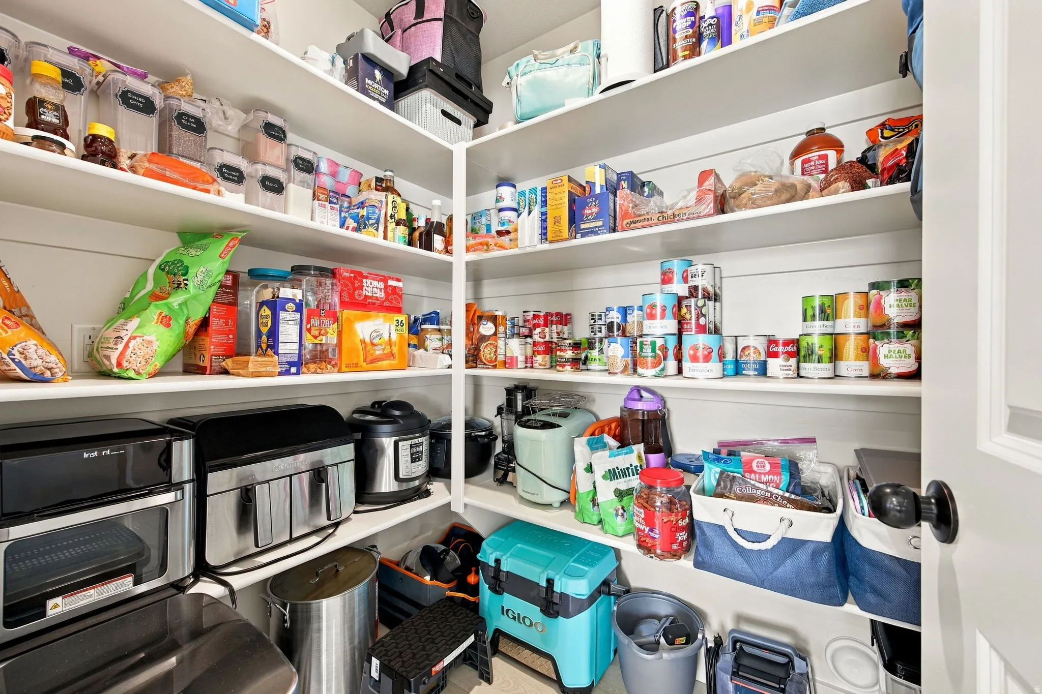 Built-in shelving with white finishes, offering extensive storage and organization