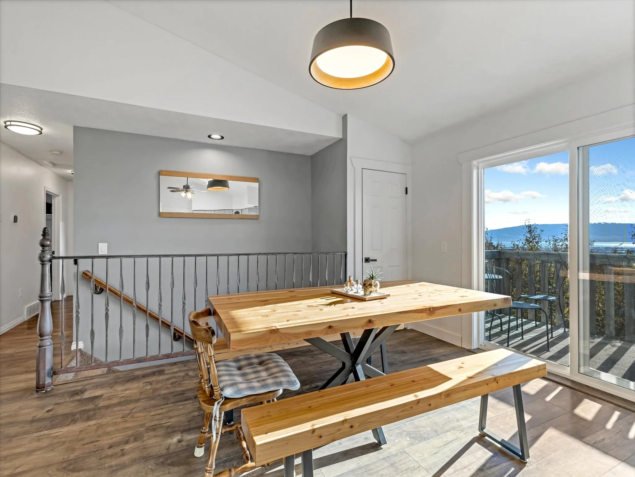 Wood-finish flooring throughout, with a contemporary pendant light fixture